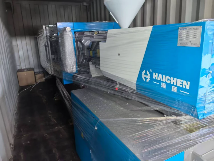 injection molding machine placed in the middle of the container